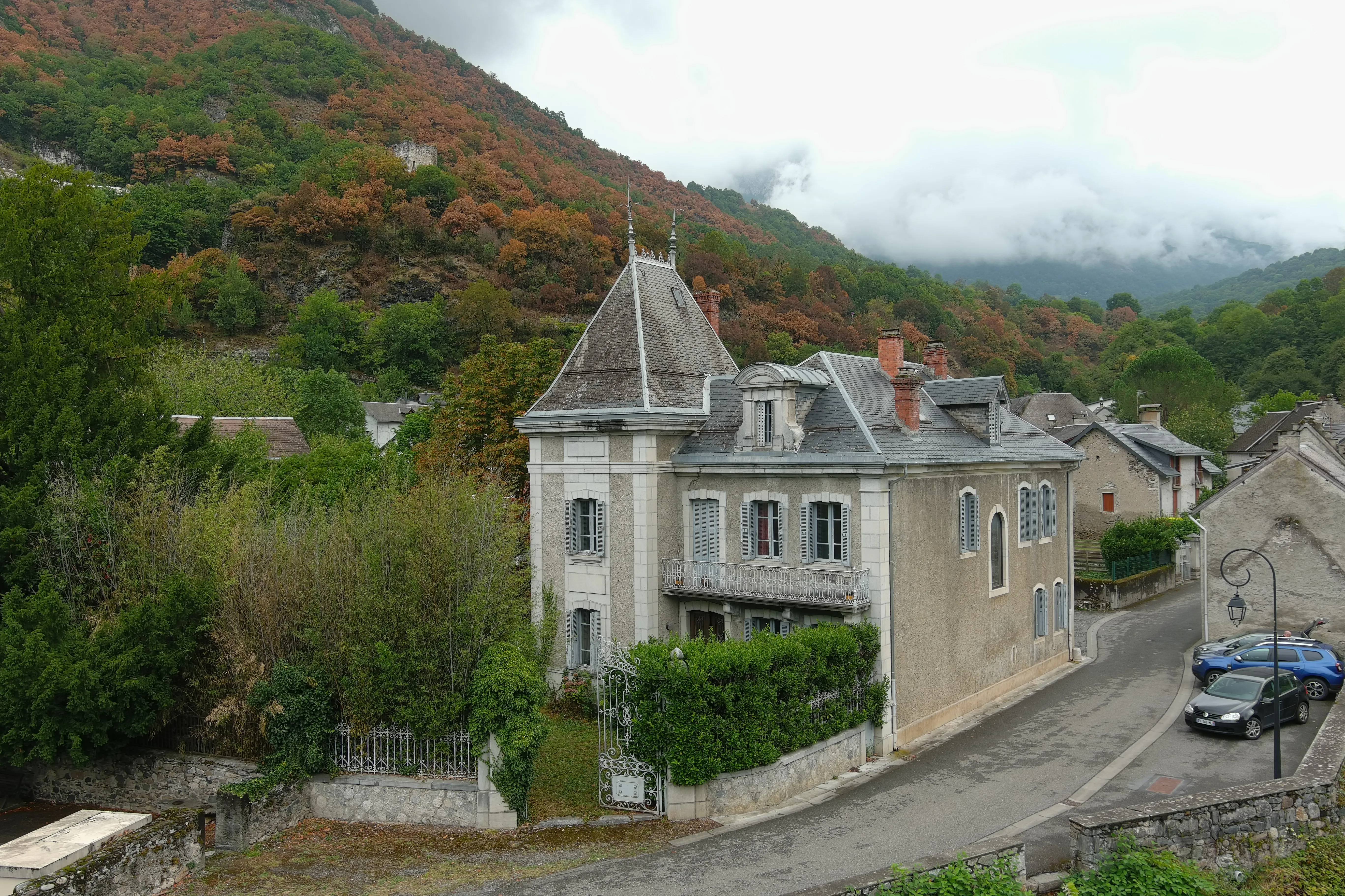 Aerial view of the château, its walled garden, and the village of Saint-Béat